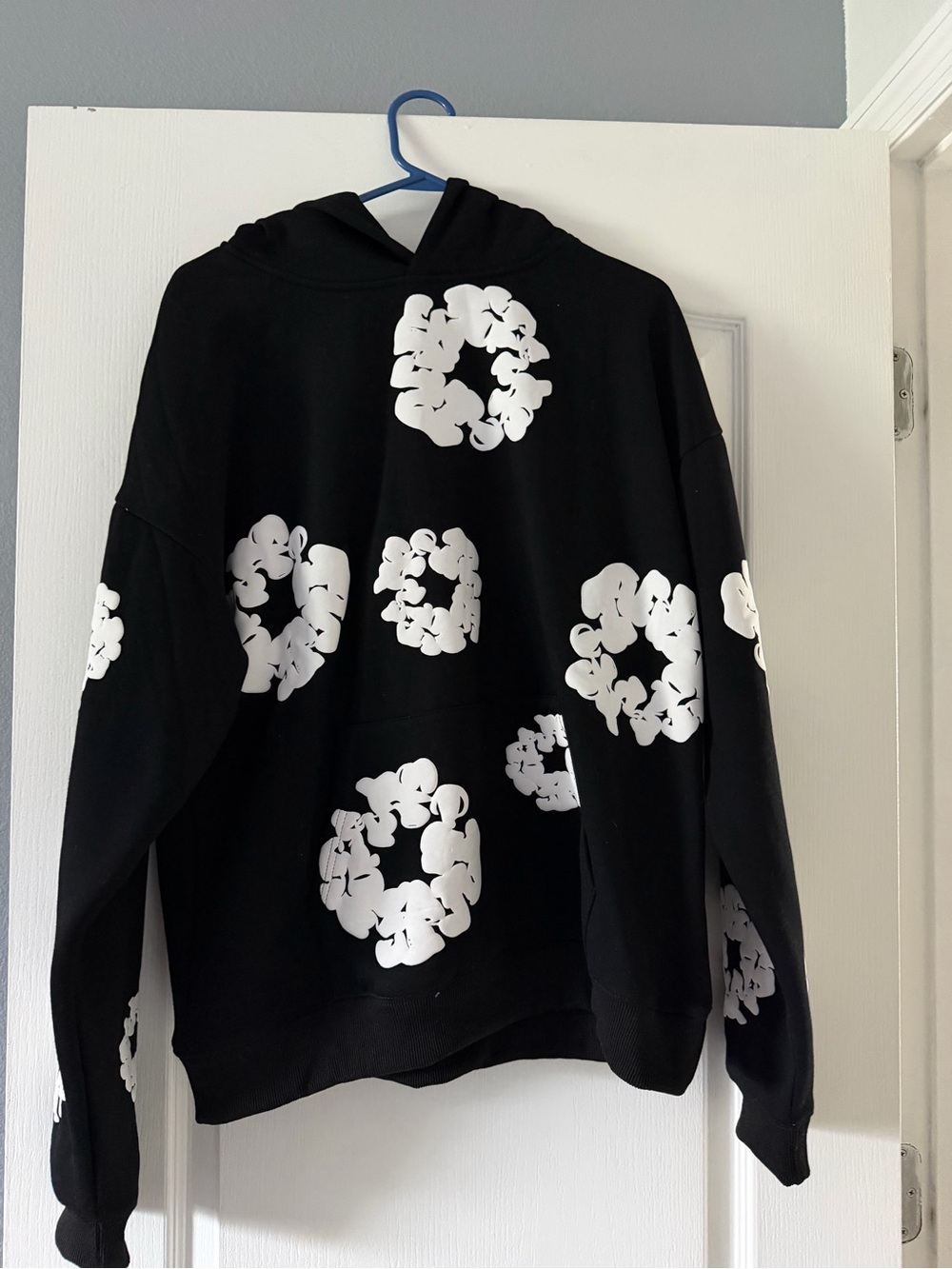 Men’s black hoodie with white flower design